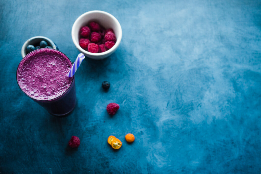Purple superfood smoothie with fresh berries demonstrating food tech healthy beverage innovation