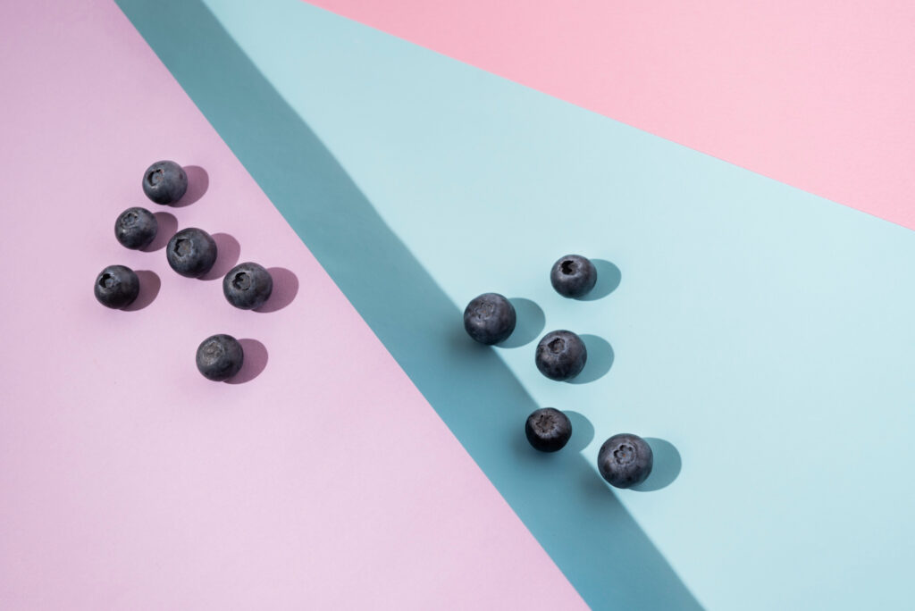 Fresh blueberries arranged on geometric surfaces highlighting food tech healthy ingredient tracking