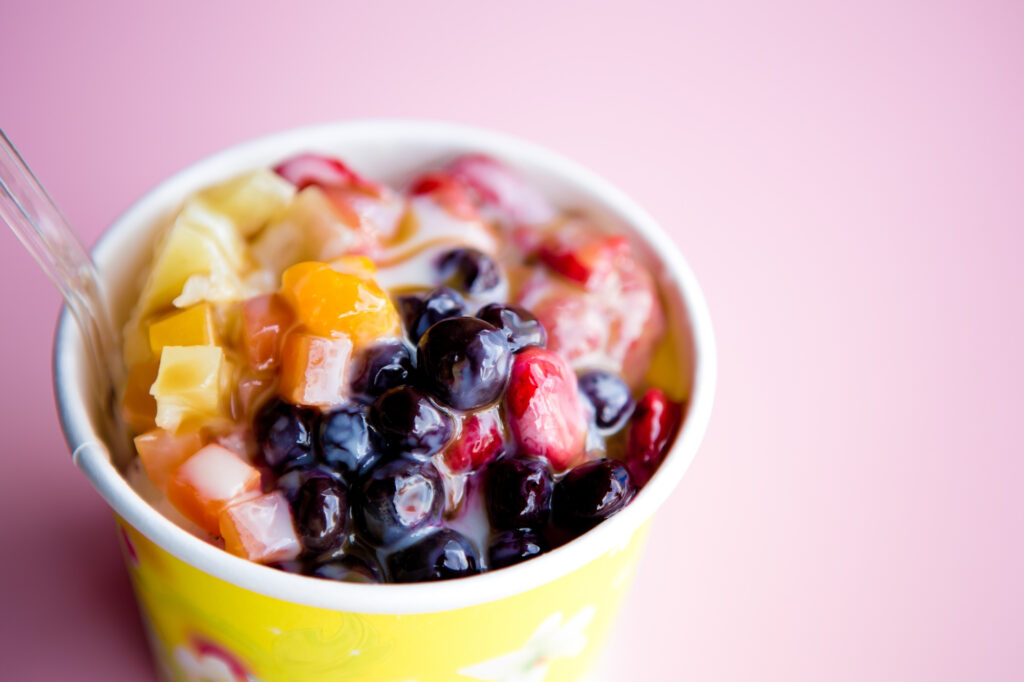 Tapioca bowl with colorful pearls and fresh fruits for creative and nutritious healthy food delivery